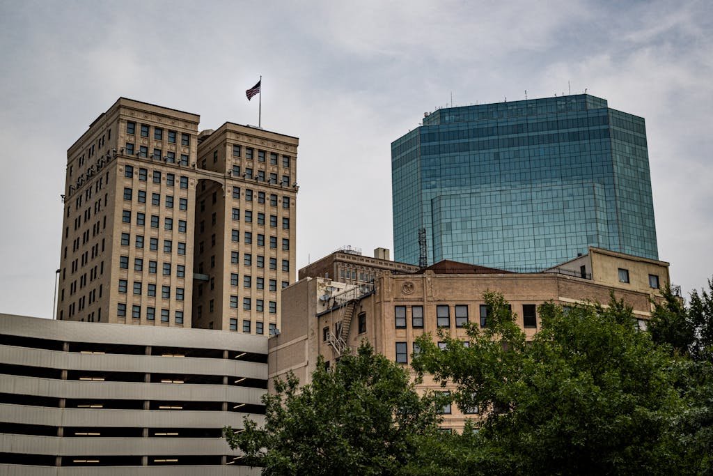 A cityscape showcasing contrasting architectural styles in downtown Fort Worth.